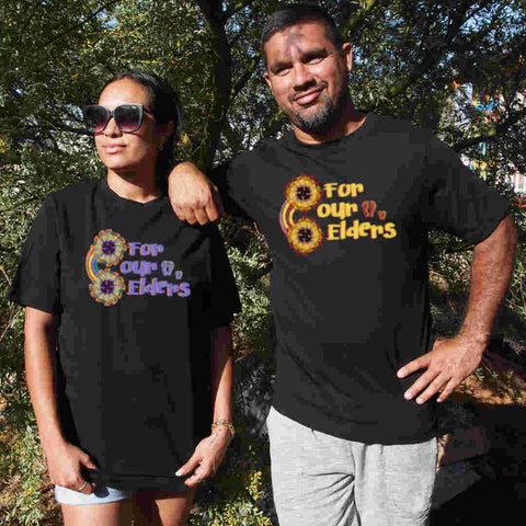 Male and Female wearing  black short sleeve t shirts with graphic design with NAIDOC Theme For Our Elders with footprints
