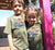 Boy and Girl with arms around each other outside a house wearingKhaki Short Sleeve kids T Shirt.  Graphic of a Troop Carrier vehicle with Palm Trees.  Text reads Carnarvon, Western Australia Camp Responsibly.