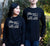 Female and Male wearing Black long sleeve short sleeve T Shirt.  Design in white.  Graphic is the words Think Flexibly written within a box in 4 different directions.  The word Think is located outside the box.
