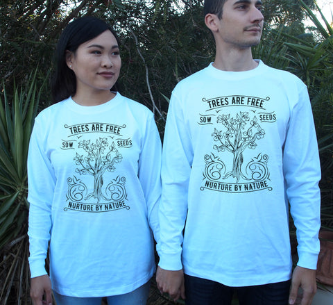 Male and Female wearing  White Long Sleeve T Shirt. Design in black. Graphic of an outline of a tree with the text Trees are Free, Sow Seeds, Nurture by Nature.
