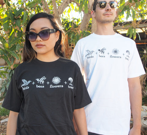 Female wearing black short sleeve t shirt and a male wearing a white short sleeve t shirt.. The design is in black on white or white on black.. The graphics are 4 outline images with words underneath and a plus sign in between. The images are of a bird, bee, flower and tree.