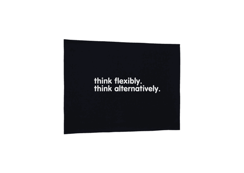 Black Tea Towel.  Design in white.  Graphic of two statements.  Think flexibly, Think alternatively.