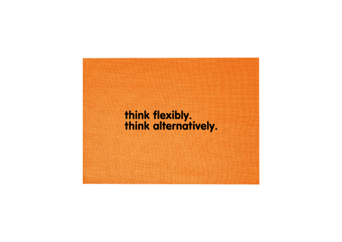 Orange Tea Towel.  Design in black.  Graphic of two statements.  Think flexibly, Think alternatively.