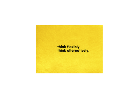 Yellow Tea Towel.  Design in black.  Graphic of two statements.  Think flexibly, Think alternatively.