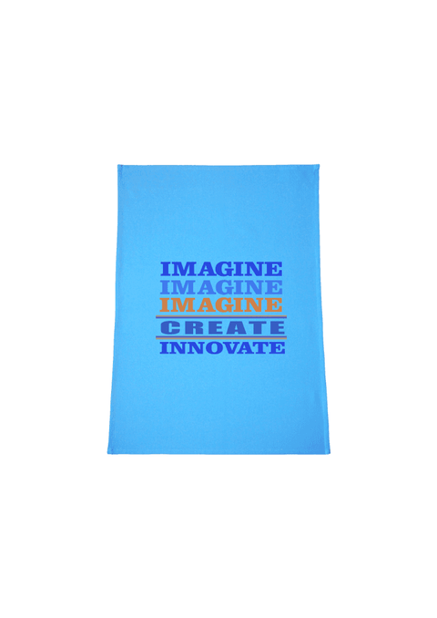 Light Blue Tea Towel.  Graphic is stacked words in shades of blue and orange.  The text reads Imagine, repeated 3 times, create, innovate.
