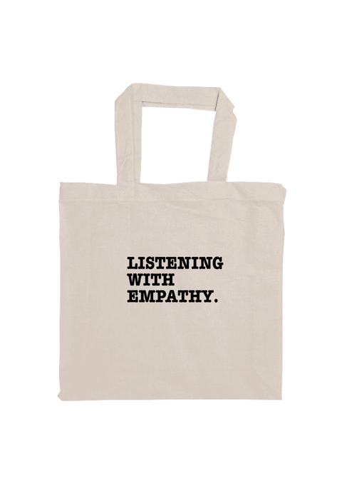 Short Handle Shopper Style Calico Bag. Graphic is stacked words in black The text reads Listening with Empathy.