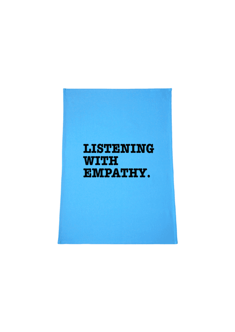 Light Blue Tea Towel. Graphic is stacked words in black. The text reads Listening with Empathy.