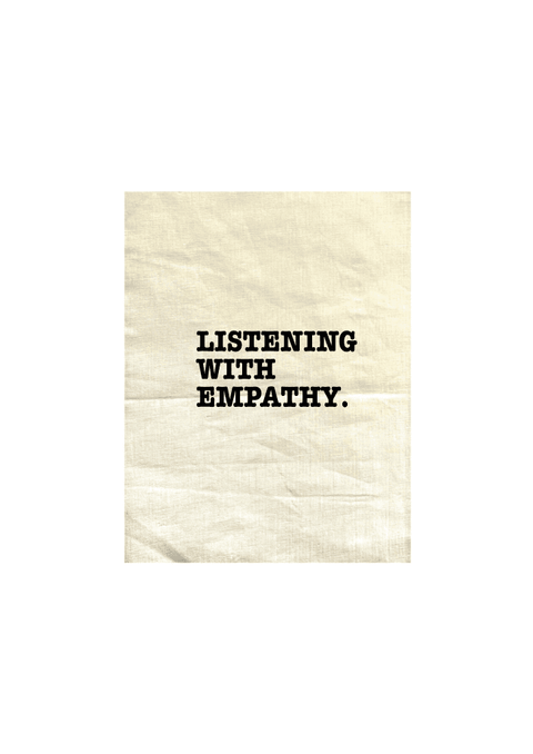 Natural Colour Tea Towel. Graphic is stacked words in black. The text reads Listening with Empathy.