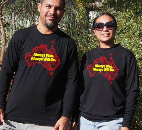 Male and Female wearing Long Sleeve Black T - shirt - with graphic - of australia map in traditional boundaries - in red.  Overtop of the map are the words Always Was Always Will Be, written in yellow.
