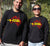 Male and Female wearing Long Sleeve Black T - shirt - with graphic - of australia map in traditional boundaries - in red.  Overtop of the map are the words Always Was Always Will Be, written in yellow. Yamatji Country is highlighted.