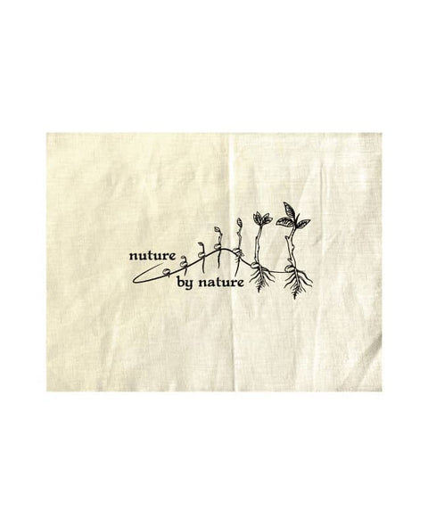 Natural Colour Tea Towel, natural colour. The design is in white. The graphic is an outline image of a seed growing in stages. The text is nurture by nature.