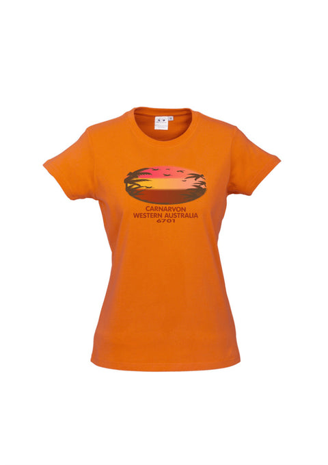 Orange fitted short sleeve t shirt.  Text in red Carnarvon, Westerm Australia.  Graphic of palm trees and birds in silhouette against a sunset.