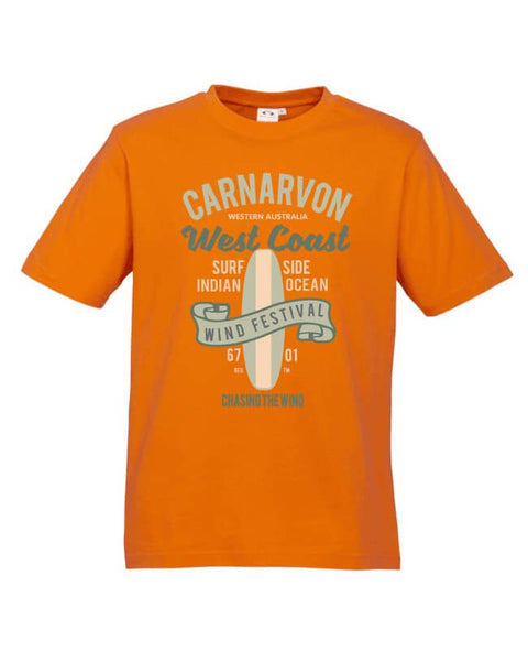 Orange Short Sleeve T Shirt. Design in blue and pink. Surfboard with banner saying Wind Festival. Text reads Carnarvon Western Australia. West Coast. Surf Side. Indian Ocean. 6701. Chasing the wind.