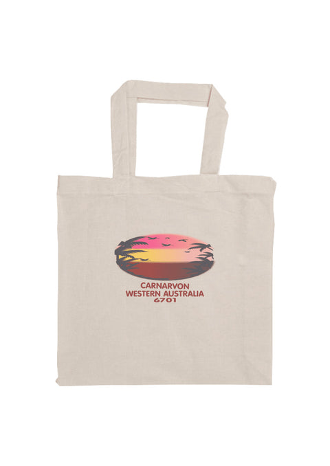 Short Handle Shopper Style Calico Bag, natural colour.  Text in red Carnarvon, Westerm Australia.  Graphic of palm trees and birds in silhouette against a sunset.