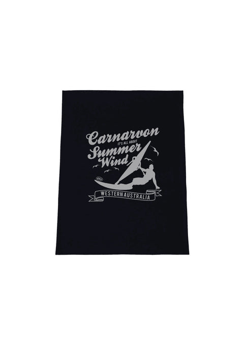 Black Tea Towel.  Design in white.  Graphic is a silhouette of a kite surfer with the text Carnarvon Western Australia.  It's all About the Summer Wind.