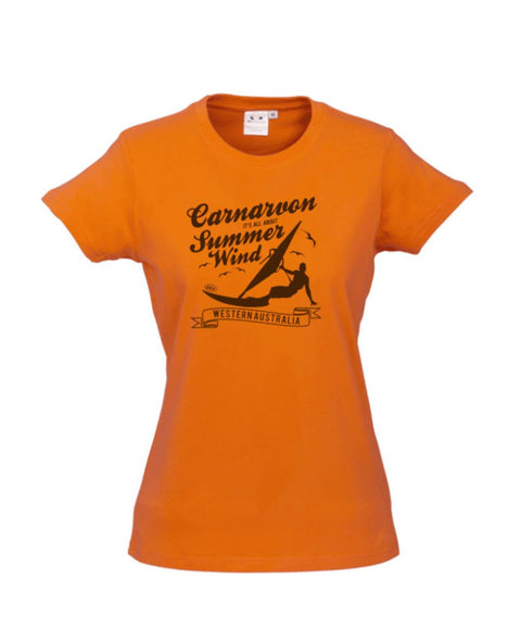 Orange fitted short sleeve t-shirt.  Design is in black.  The graphics are of a silhouette of a wind surfer with the text Wind Riders, Carnarvon Western Australia.